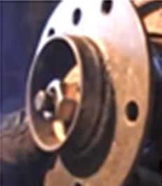 File:Use Washer and Nut to Press Rear Axle Shaft Flange Into Wheel Carrier Housing.JPG