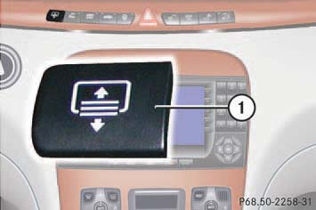 File:W220 rear sunshade control button.png