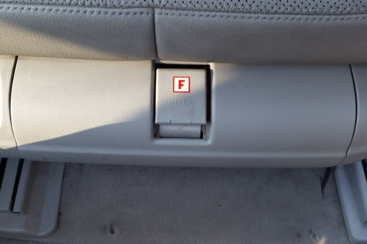 File:W220 drivers seat fire extinguisher compartment.jpg