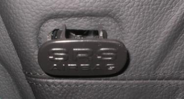 File:W220 Door SRS Air Bag Plate Covering Panel Screw.jpg