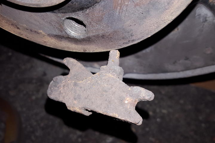 File:W220 rear brake shoes expansion lock seized removed.jpg