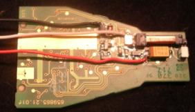 File:Battery Side of Remote Control Key PCB Showing Test Wires Soldered Across the Induction Coil and the Storage Capacitor.jpg