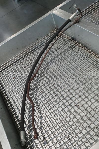 File:W220 transmission cooler supply line original and rubber.jpg