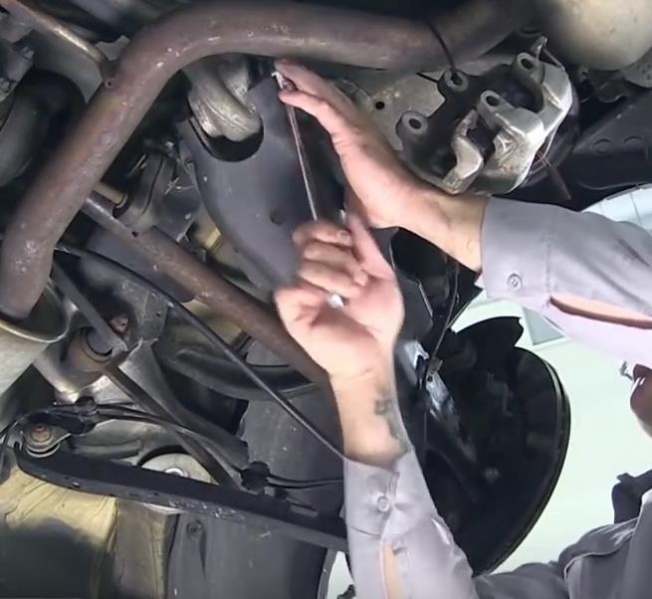 File:W220 Spring Control Arm to Axle Carrier Inner bolted connection.jpg