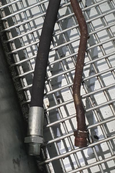 File:W220 transmission cooler supply line original and rubber2.jpg