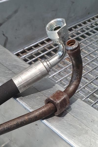 File:W220 transmission cooler supply line original and rubber3.jpg